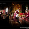 Young Nepali buddhist monk serving milk tea, Kathmandu