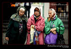 Babushkas waiting for coins