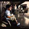 Boy waitin on a bus in Mendoza, Argentina