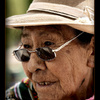 Old woman in Puno, Peru selling sweets
